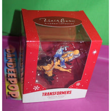 Load image into Gallery viewer, Carlton Heirloom Transformers Optimus Prime On Dinosaur 051F Holiday Ornament
